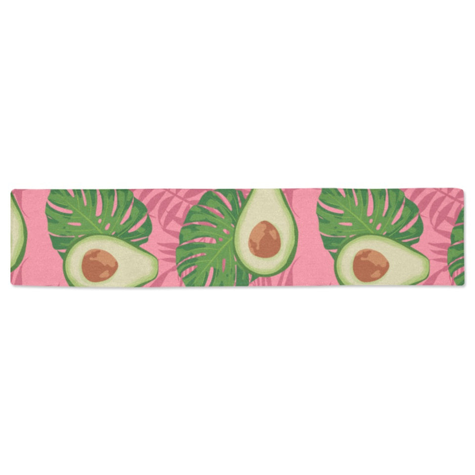 Avocado slices leaves pink back ground Table Runner