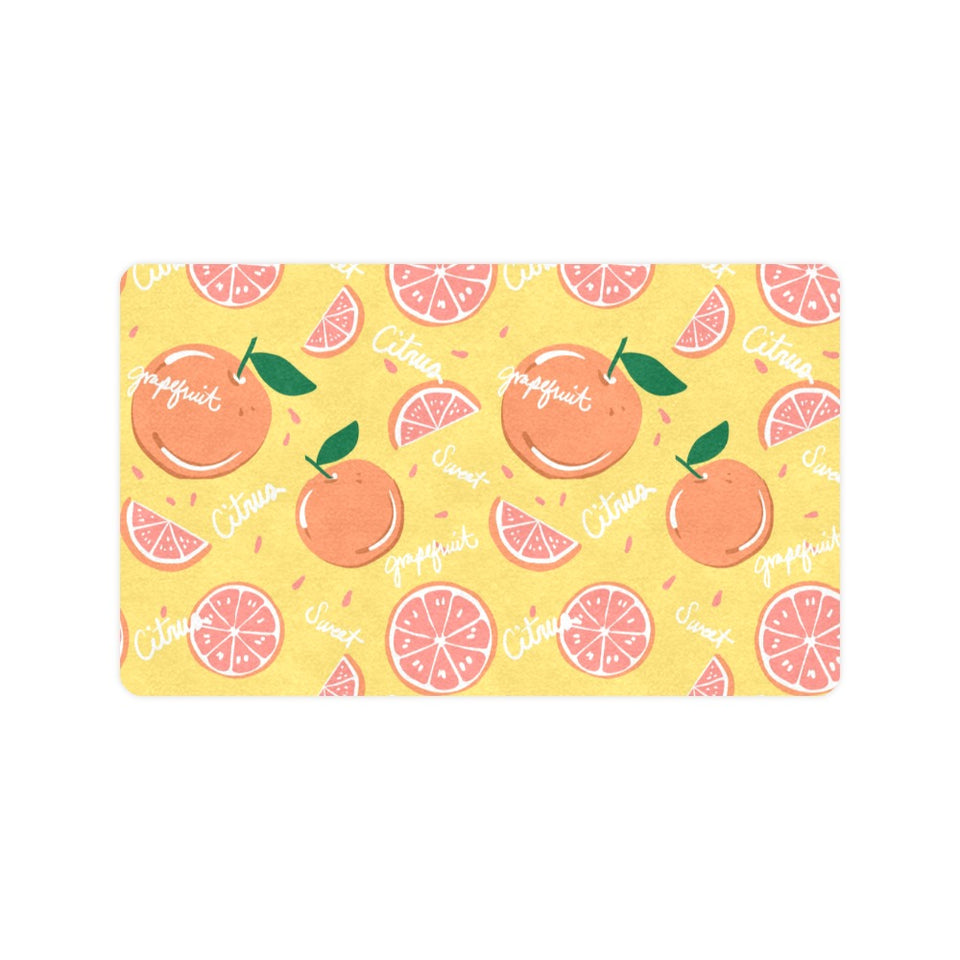 Grapefruit yellow background Doormat