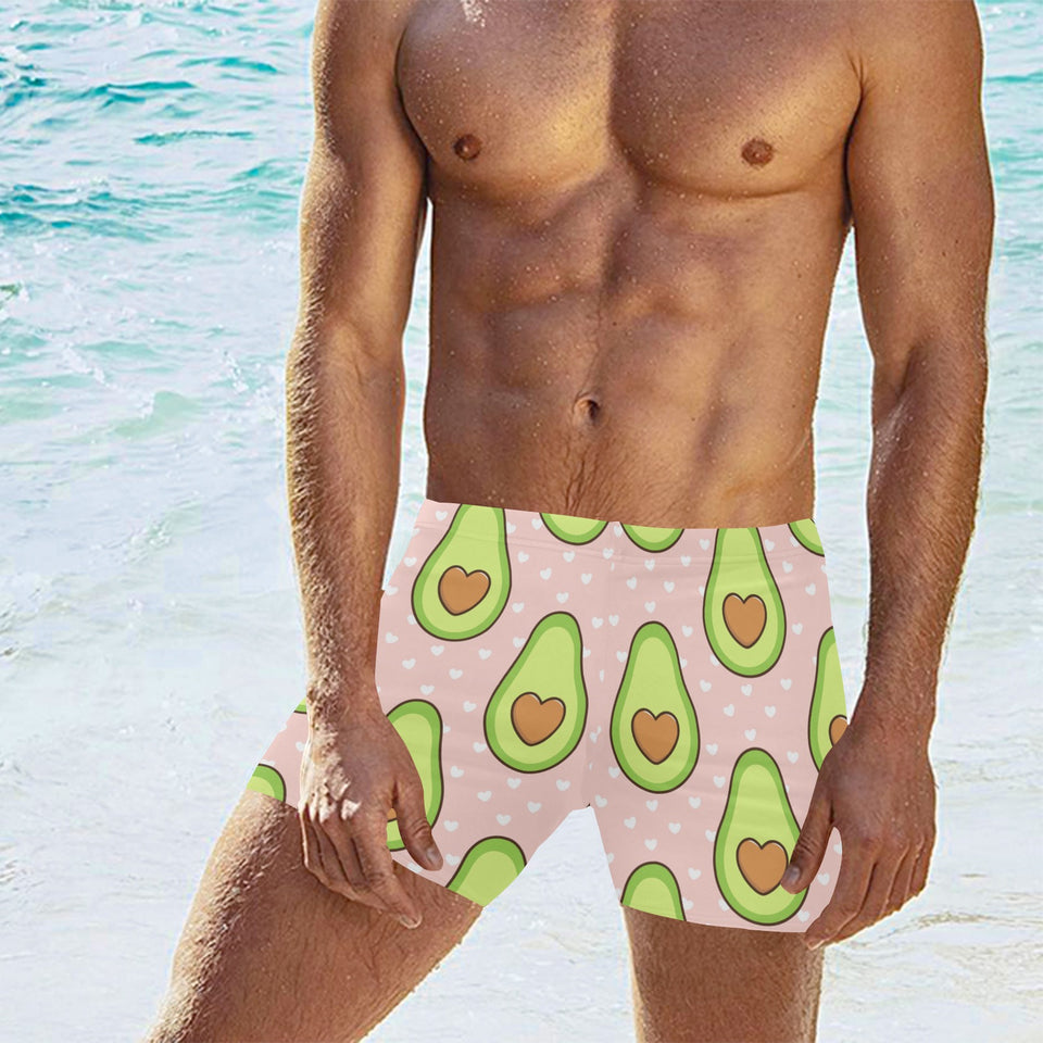 Avocado heart pink background Men's Swimming Trunks