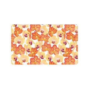 Orange yellow orchid flower pattern background Doormat