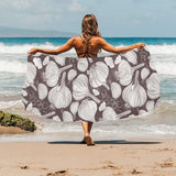 Garlic bulb dark background Beach Towel