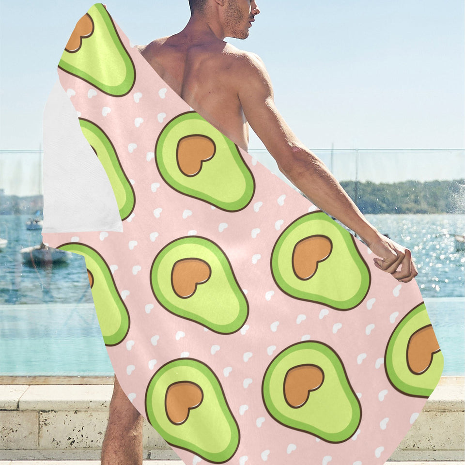 Avocado heart pink background Beach Towel