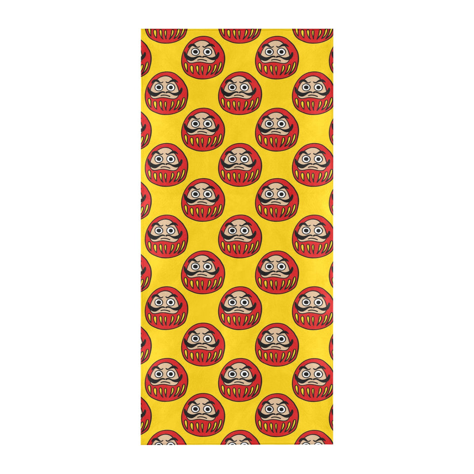 Daruma japanese wooden doll yellow background Beach Towel