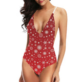 Snowflake pattern red background Women's One-Piece Swimsuit