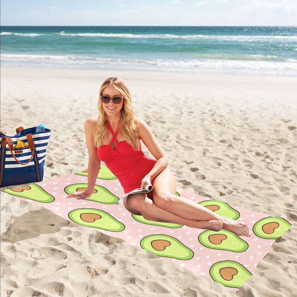 Avocado heart pink background Beach Towel