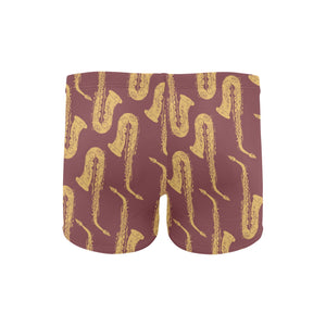 Hand drawn gold saxophone red background Men's Swimming Trunks