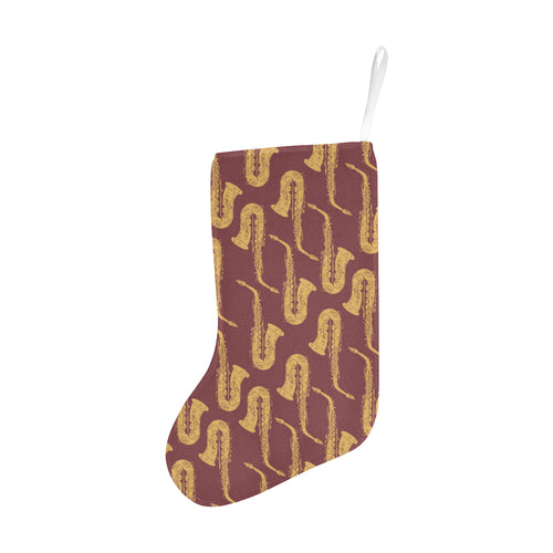 Hand drawn gold saxophone red background Christmas Stocking