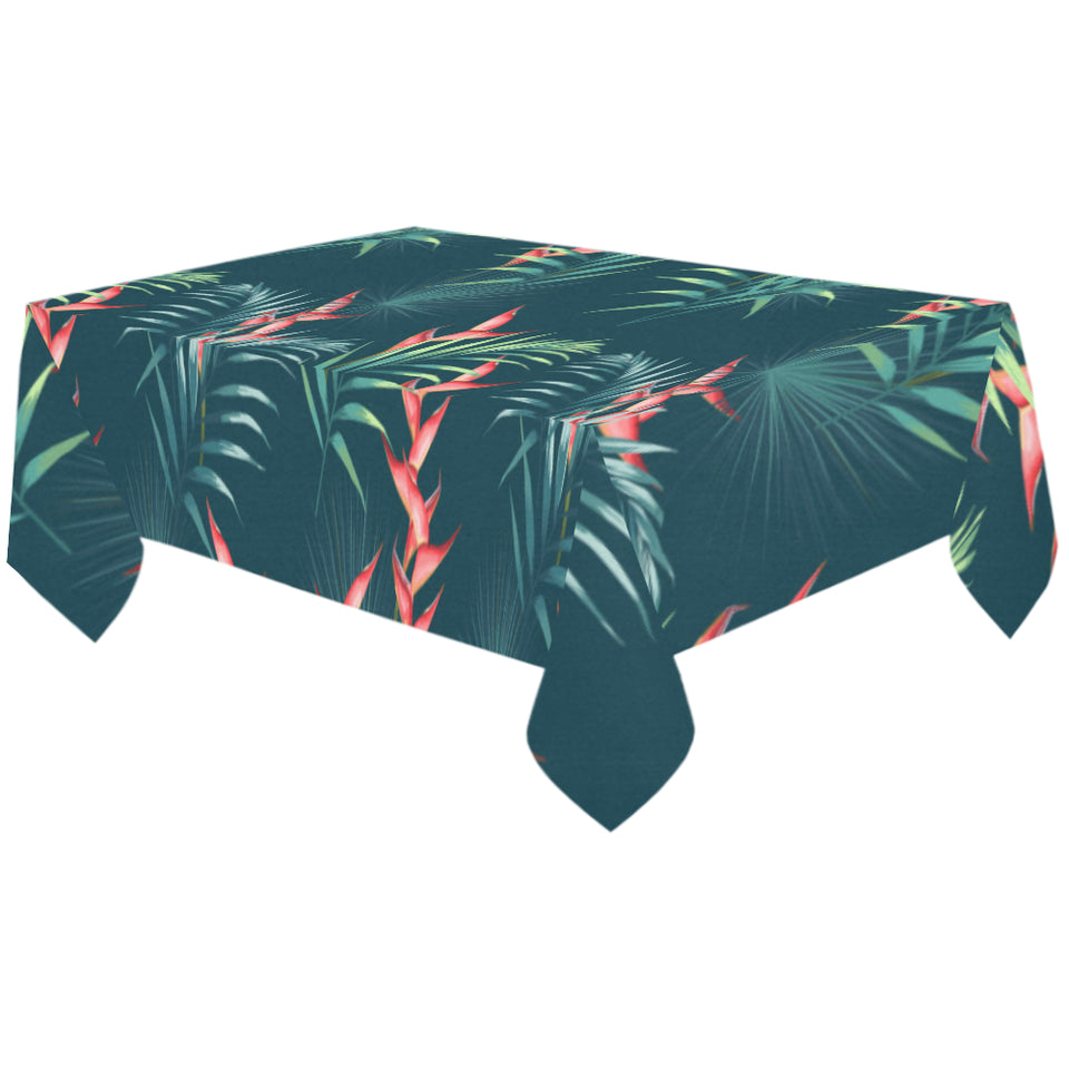 heliconia flowers, palm and monstera leaves on bla Tablecloth