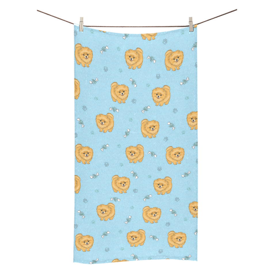 Brown cute pomeranian blue blackground Bath Towel