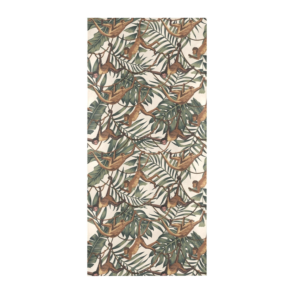 Monkey tropical leaves background Beach Towel