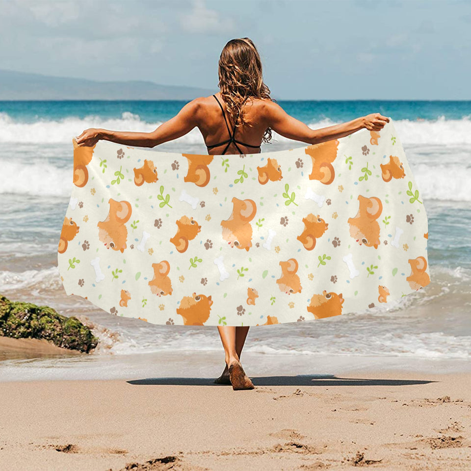 Cute brown pomeranian paw leave bone pattern Beach Towel