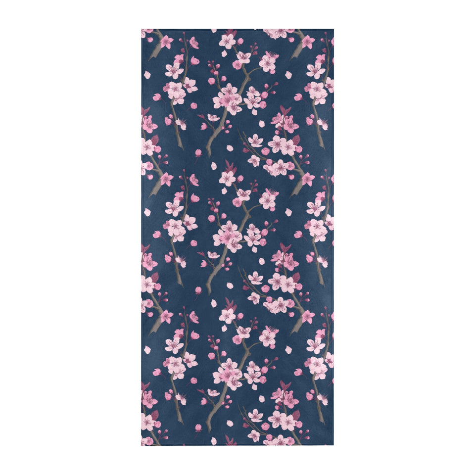 Pink sakura cherry blossom blue background Beach Towel