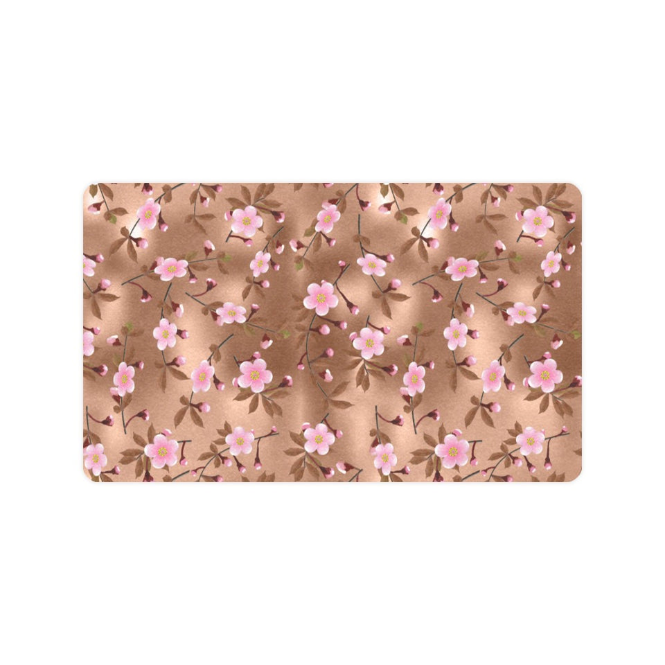 Pink sakura cherry blossom drak brown background Doormat