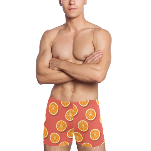 Oranges pattern red background Men's Swimming Trunks