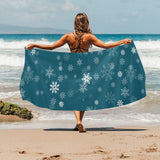 Snowflake pattern dark background Beach Towel