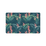heliconia flowers, palm and monstera leaves on bla Doormat