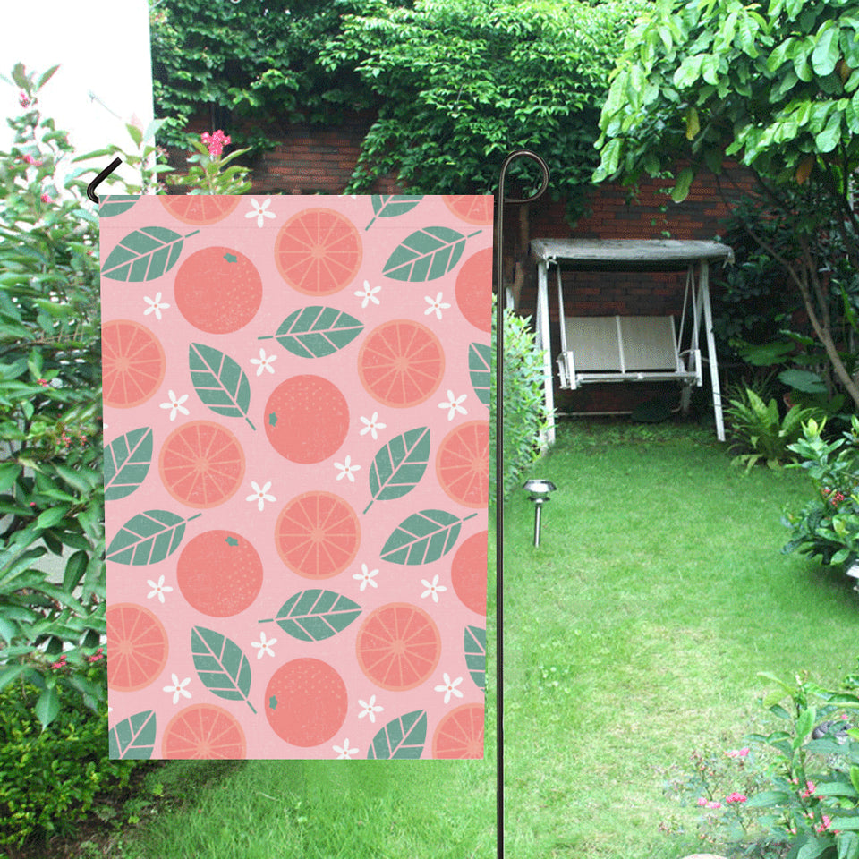 Grapefruit leaves flower pink background House Flag Garden Flag