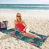 heliconia flowers, palm and monstera leaves on bla Beach Towel