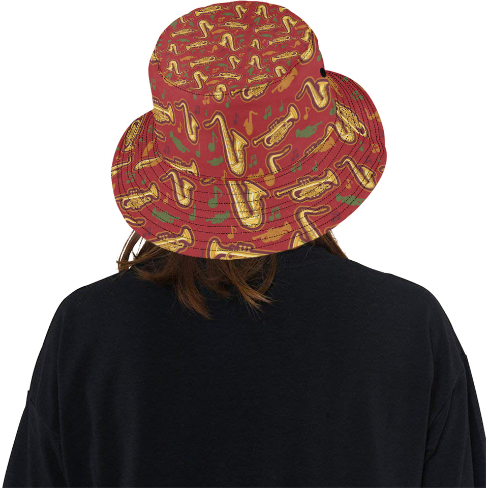 Saxophone cornet pattern red background Unisex Bucket Hat