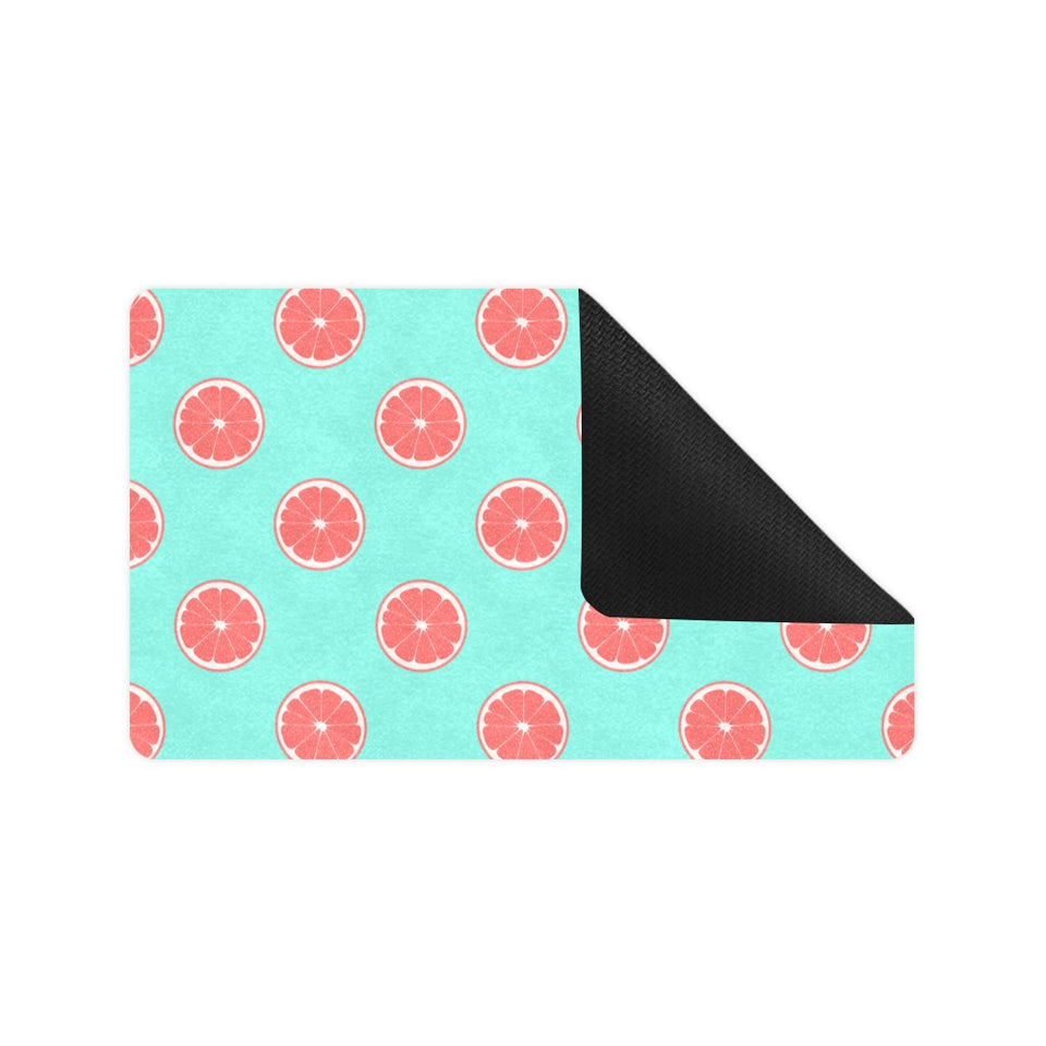 Grapefruit green background Doormat