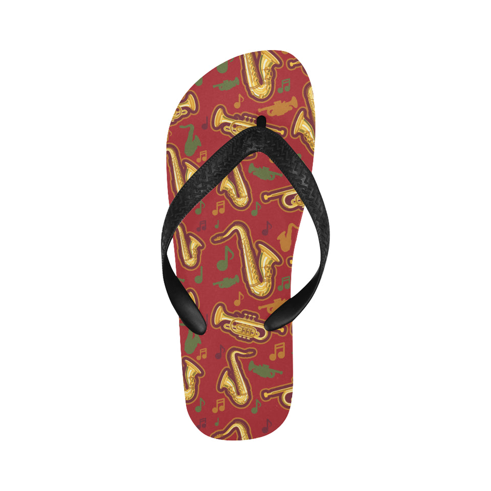 Saxophone cornet pattern red background Unisex Flip Flops
