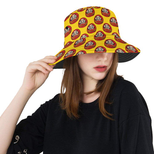 Daruma japanese wooden doll yellow background Unisex Bucket Hat