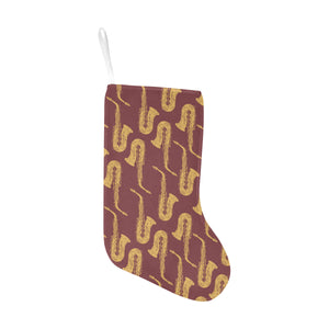 Hand drawn gold saxophone red background Christmas Stocking
