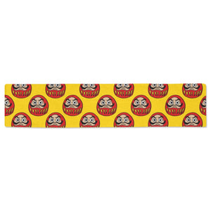 Daruma japanese wooden doll yellow background Table Runner