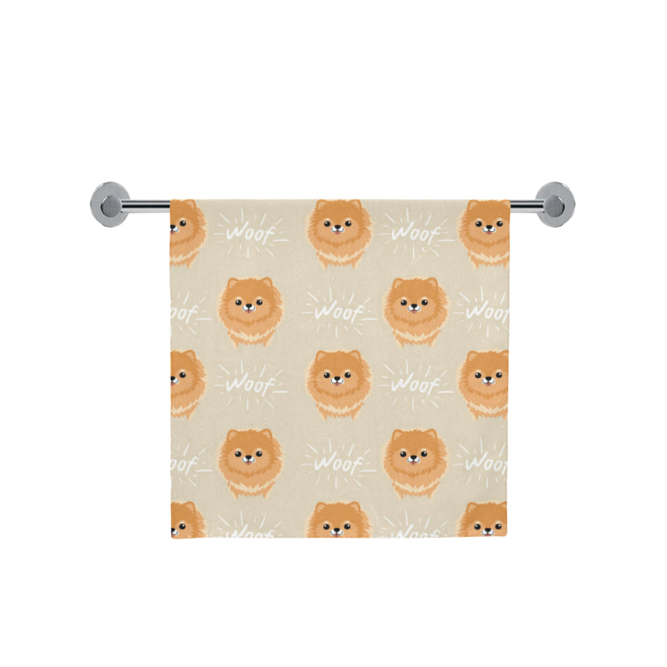 Cute brown pomeranian puppy on blue Bath Towel