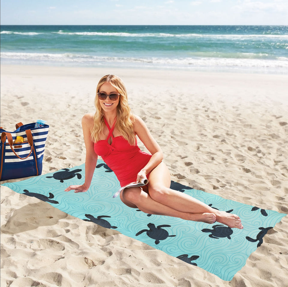 Sea turtle with blue ocean backgroud Beach Towel