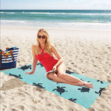 Sea turtle with blue ocean backgroud Beach Towel
