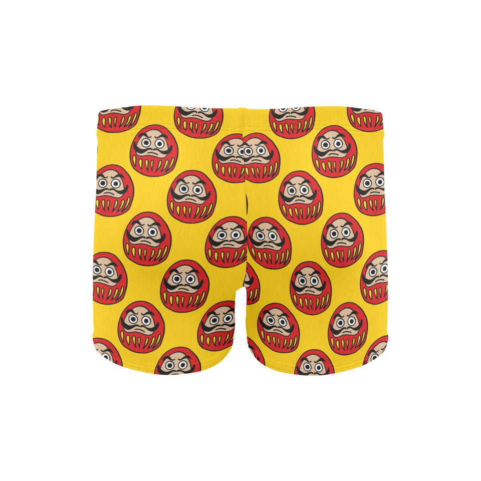 Daruma japanese wooden doll yellow background Men's Swimming Trunks