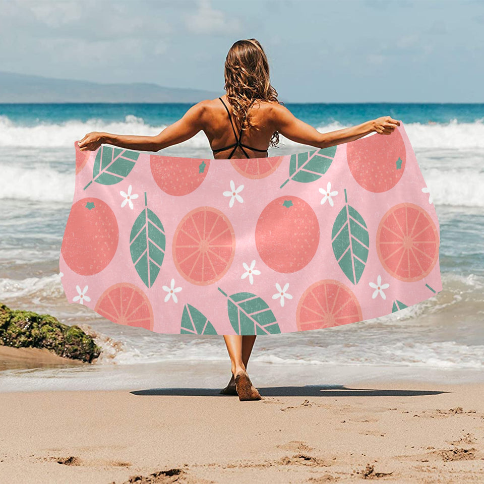 Grapefruit leaves flower pink background Beach Towel