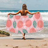 Grapefruit leaves flower pink background Beach Towel