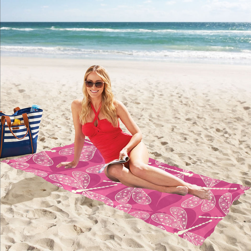 Beautiful dragonfly pink background Beach Towel