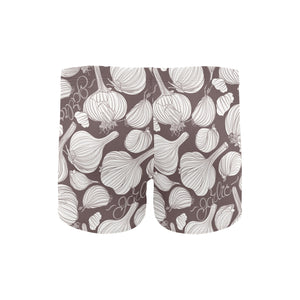 Garlic bulb dark background Men's Swimming Trunks