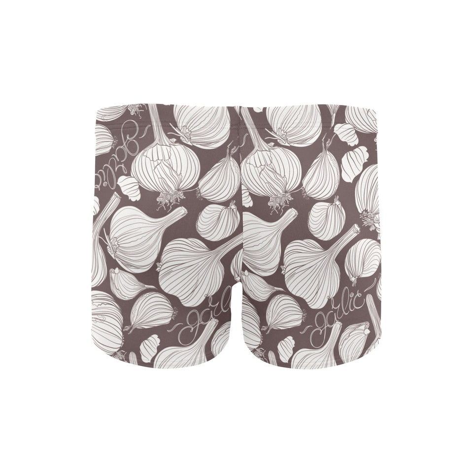 Garlic bulb dark background Men's Swimming Trunks
