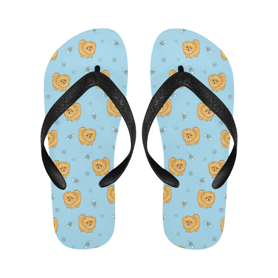 Brown cute pomeranian blue blackground Unisex Flip Flops