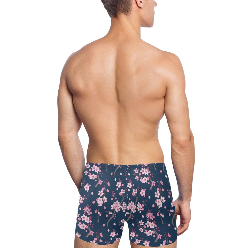 Pink sakura cherry blossom blue background Men's Swimming Trunks