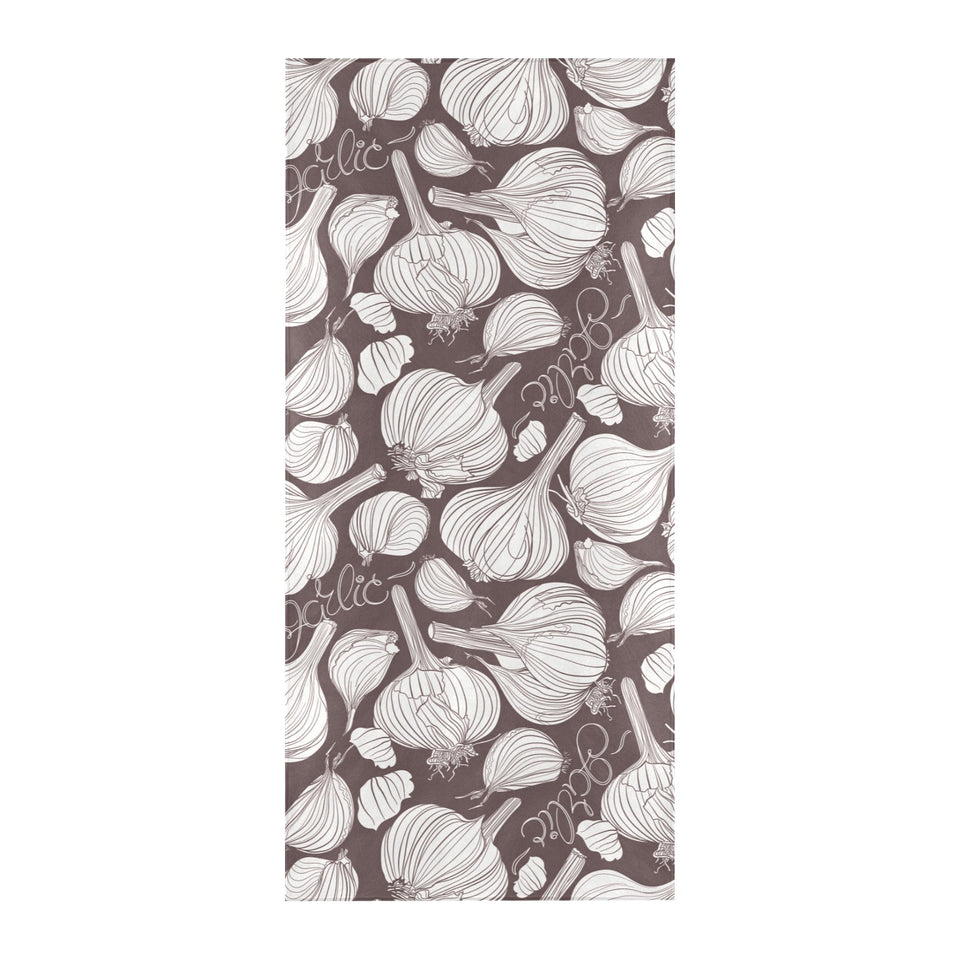Garlic bulb dark background Beach Towel