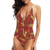 Saxophone cornet pattern red background Women's One-Piece Swimsuit