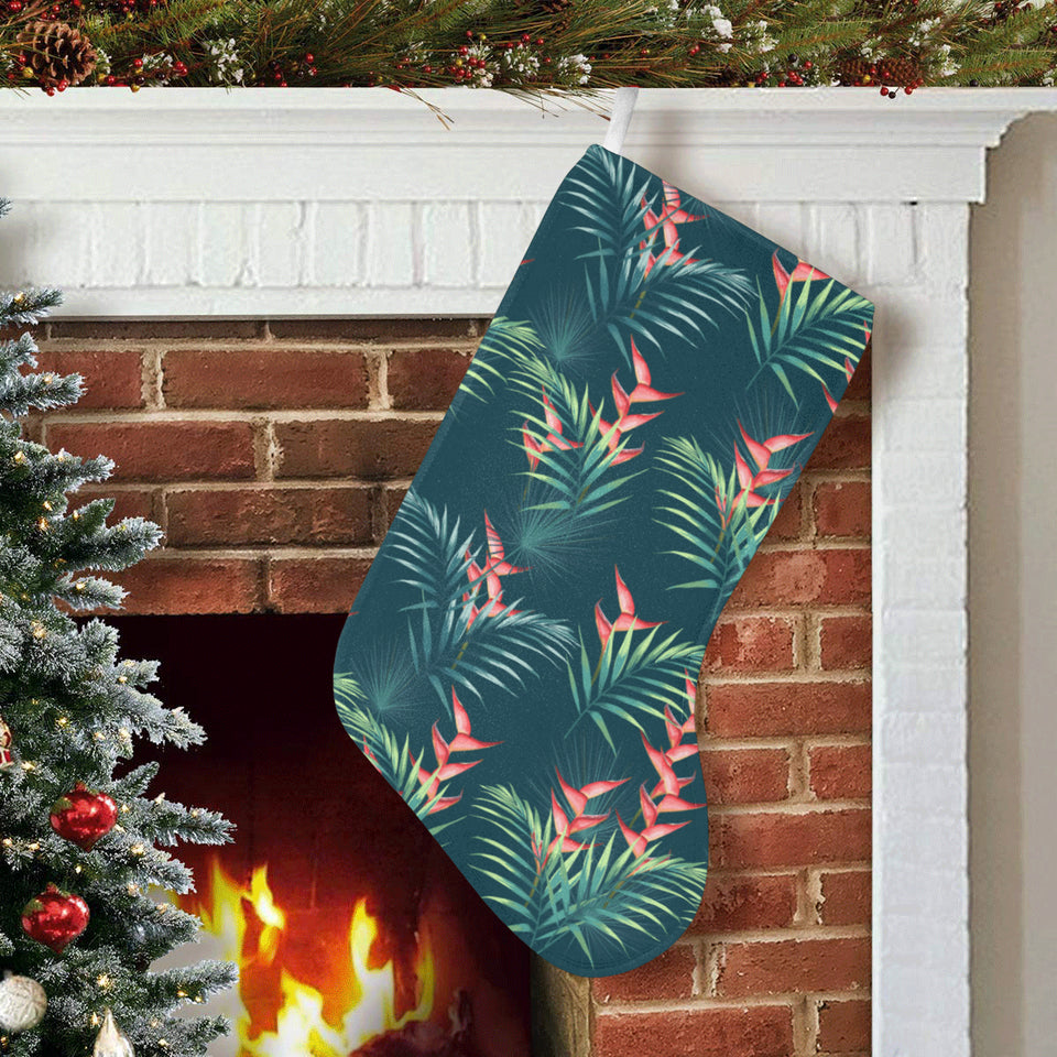 heliconia flowers, palm and monstera leaves on bla Christmas Stocking