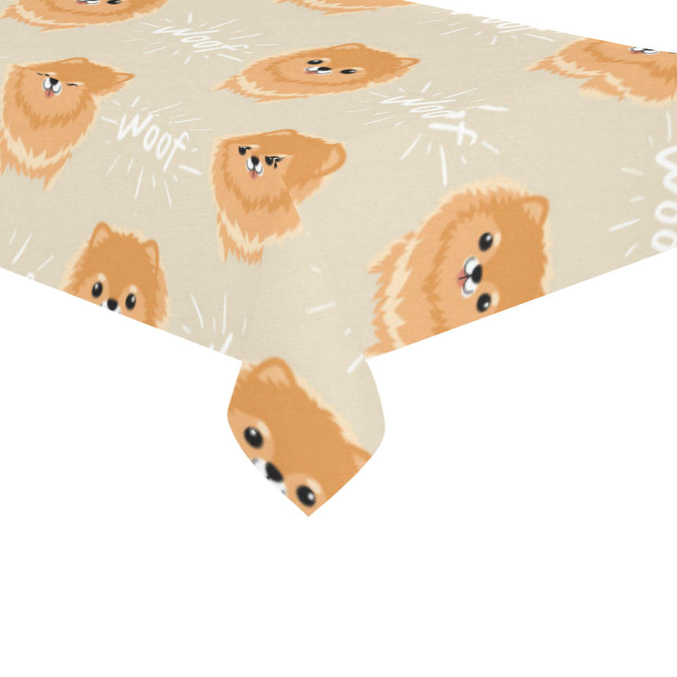 Cute brown pomeranian puppy on blue Tablecloth