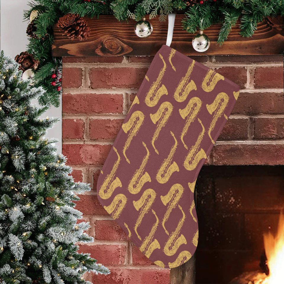Hand drawn gold saxophone red background Christmas Stocking