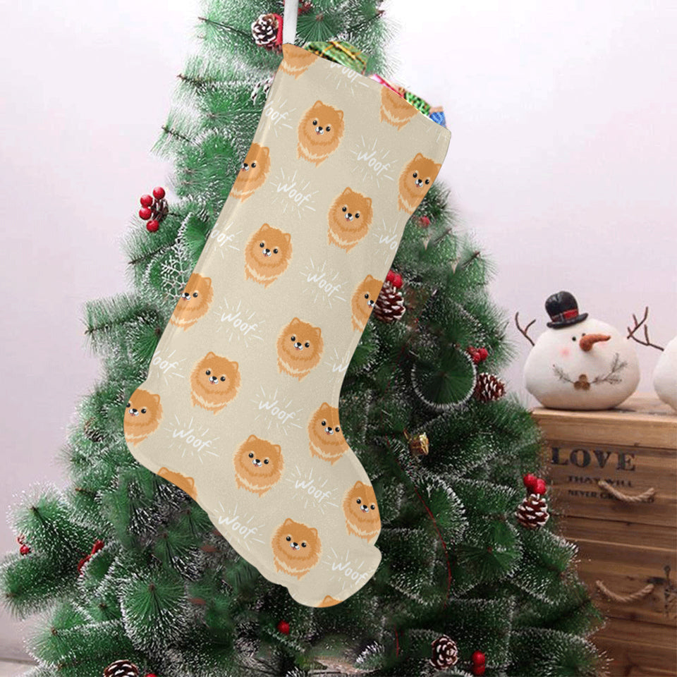 Cute brown pomeranian puppy on blue Christmas Stocking