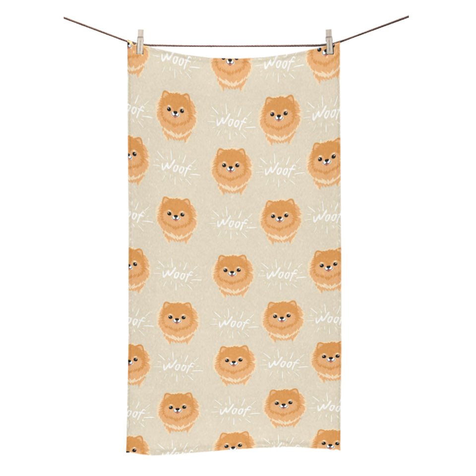 Cute brown pomeranian puppy on blue Bath Towel