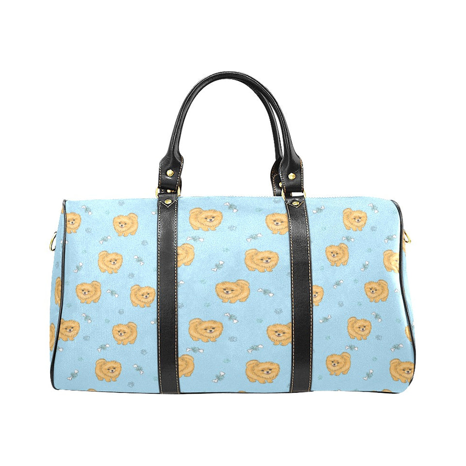 Brown cute pomeranian blue blackground Travel Bag