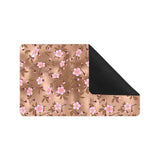 Pink sakura cherry blossom drak brown background Doormat