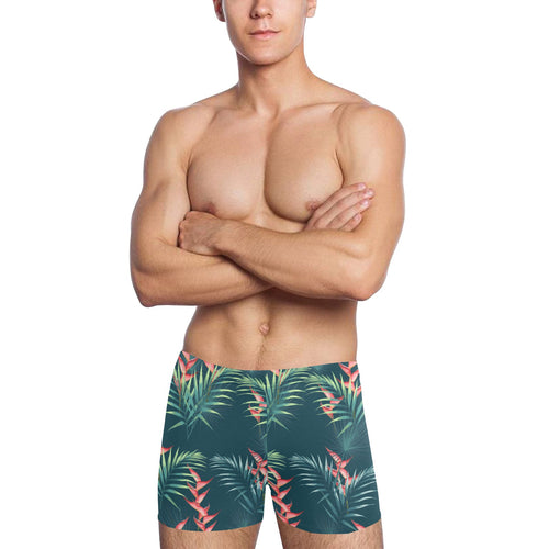 heliconia flowers, palm and monstera leaves on bla Men's Swimming Trunks