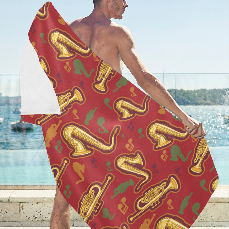 Saxophone cornet pattern red background Beach Towel
